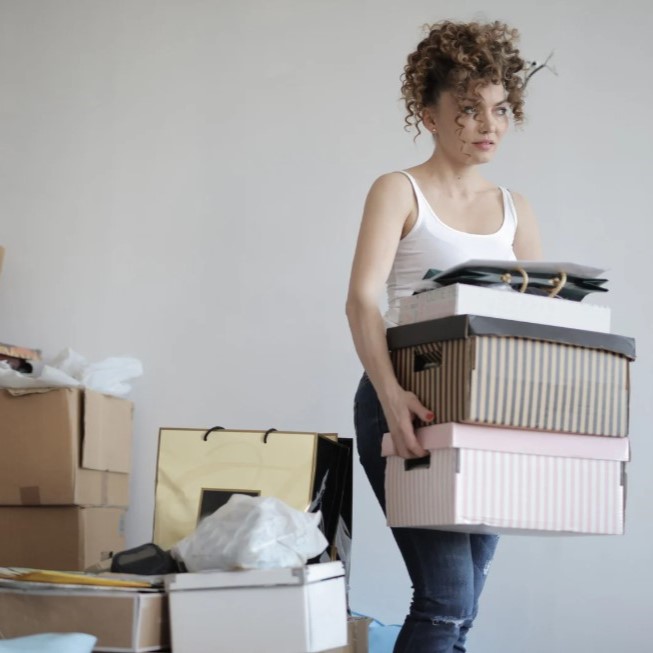 Woman moving her boxes of posessions