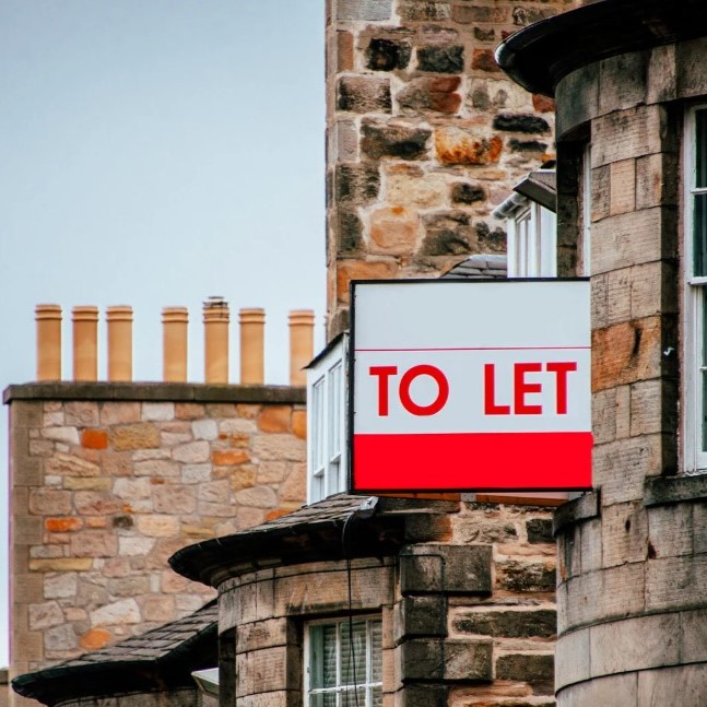 to let sign on the side of a house